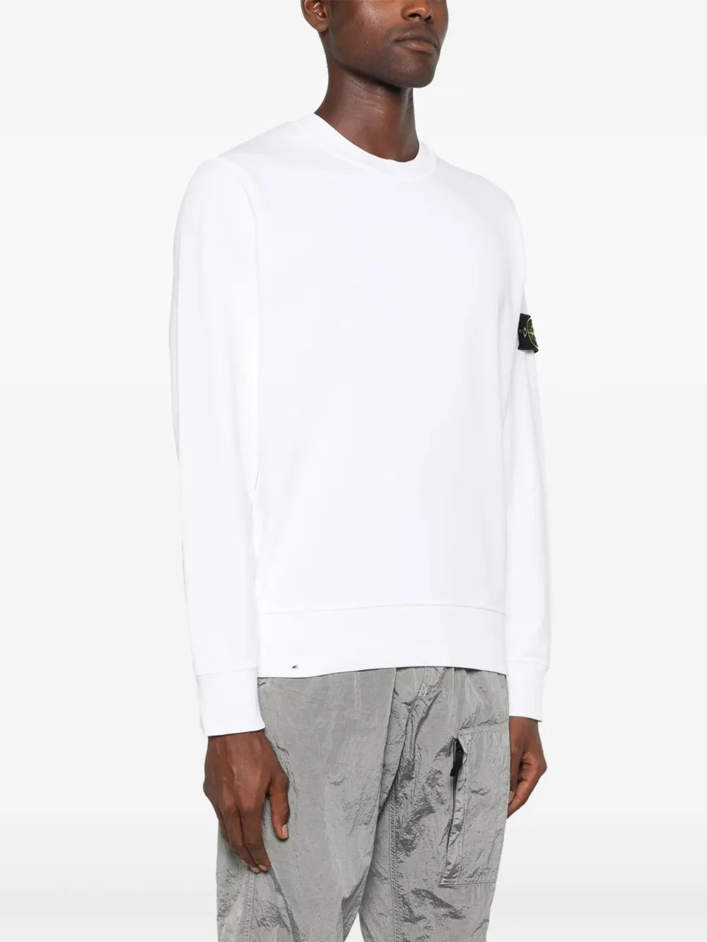 White sweatshirt worn by a person, showing the sweatshirt fit
