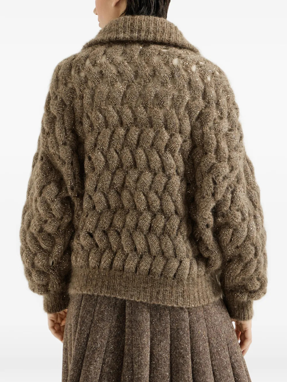 Brown knitwear worn by a person, showing the knitwear fit