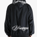 Black jacket worn by a person, showing the jacket's fit