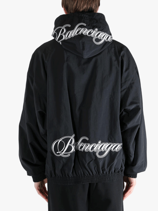 Black jacket worn by a person, showing the jacket's fit