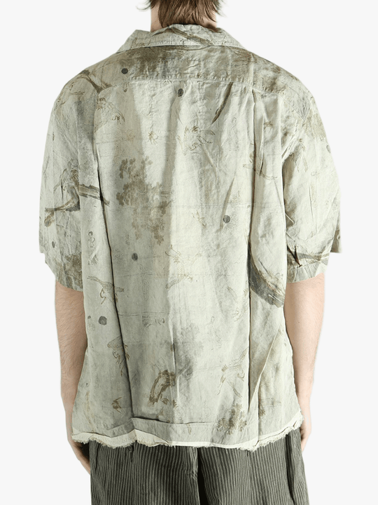 Green shirt worn by a person, showing the shirt's fit