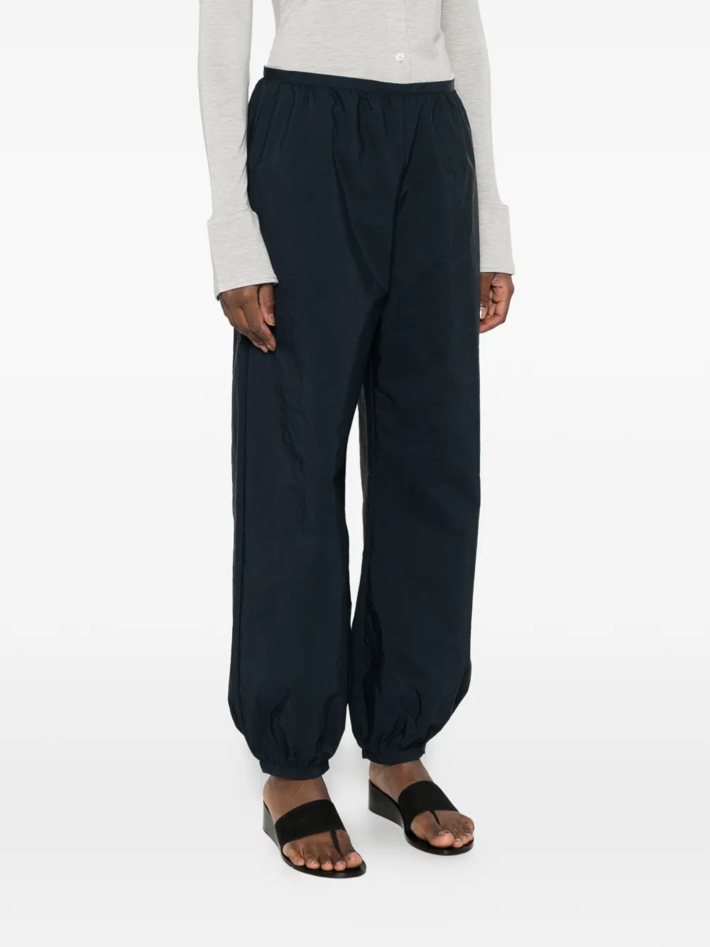 Blue pants worn by a person, showing the blue pants' fit