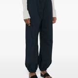 Blue pants worn by a person, showing the blue pants' fit
