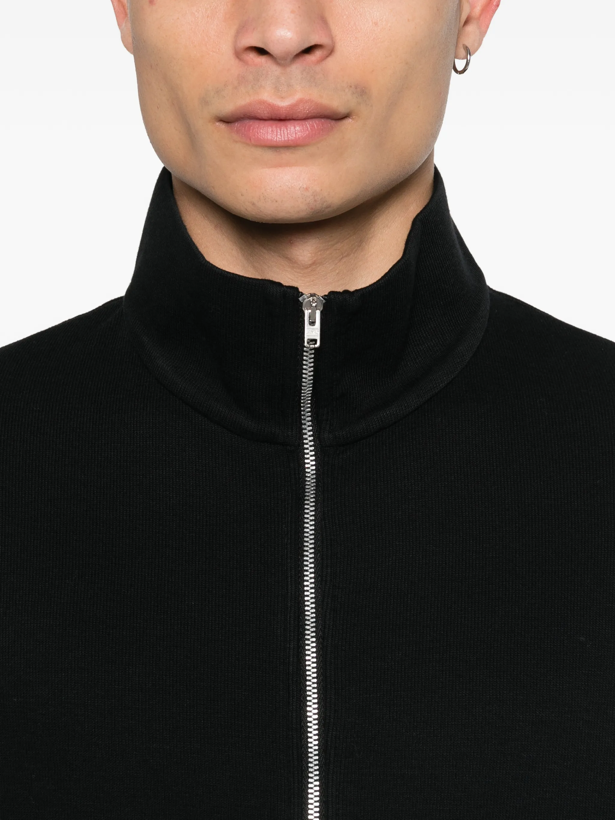 Close up of black sweat, showing texture of the Cotton fabric