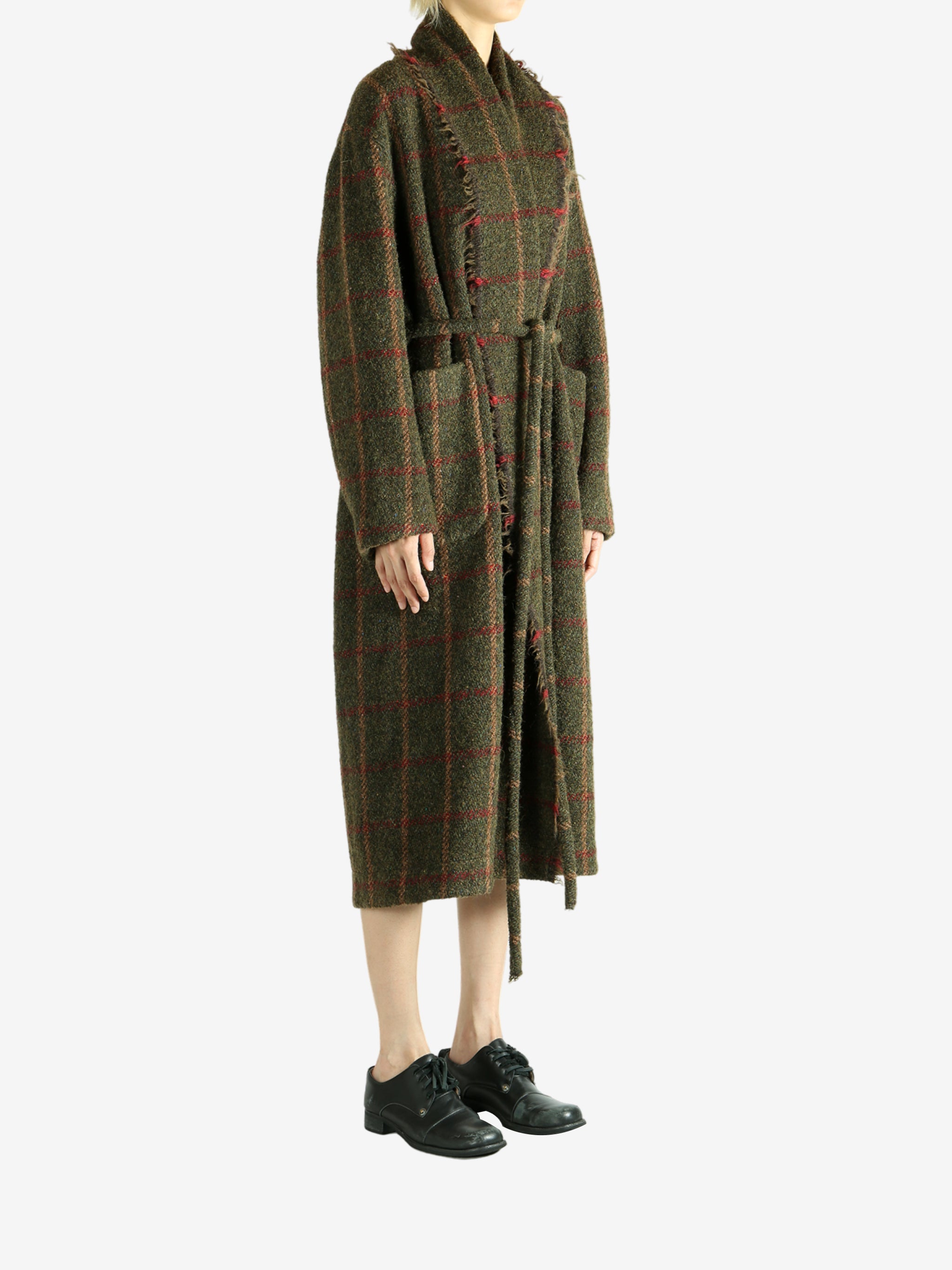 Green dress worn by a person, showing the dress fit