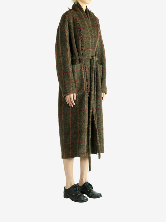 Green dress worn by a person, showing the dress fit