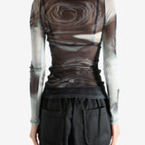 Grey top worn by a person, showing the top's fit