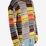 Yellow sweater worn by a person, showing the sweater’s fit