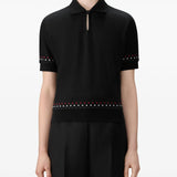 Black t-shirt worn by a person, showing t-shirt's fit