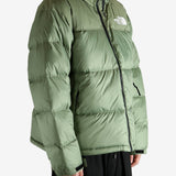 Green jacket worn by a person, showing the jacket's fit