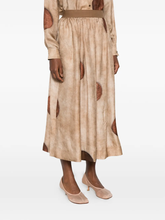 Tan skirt worn by a person, showing the skirt's fit