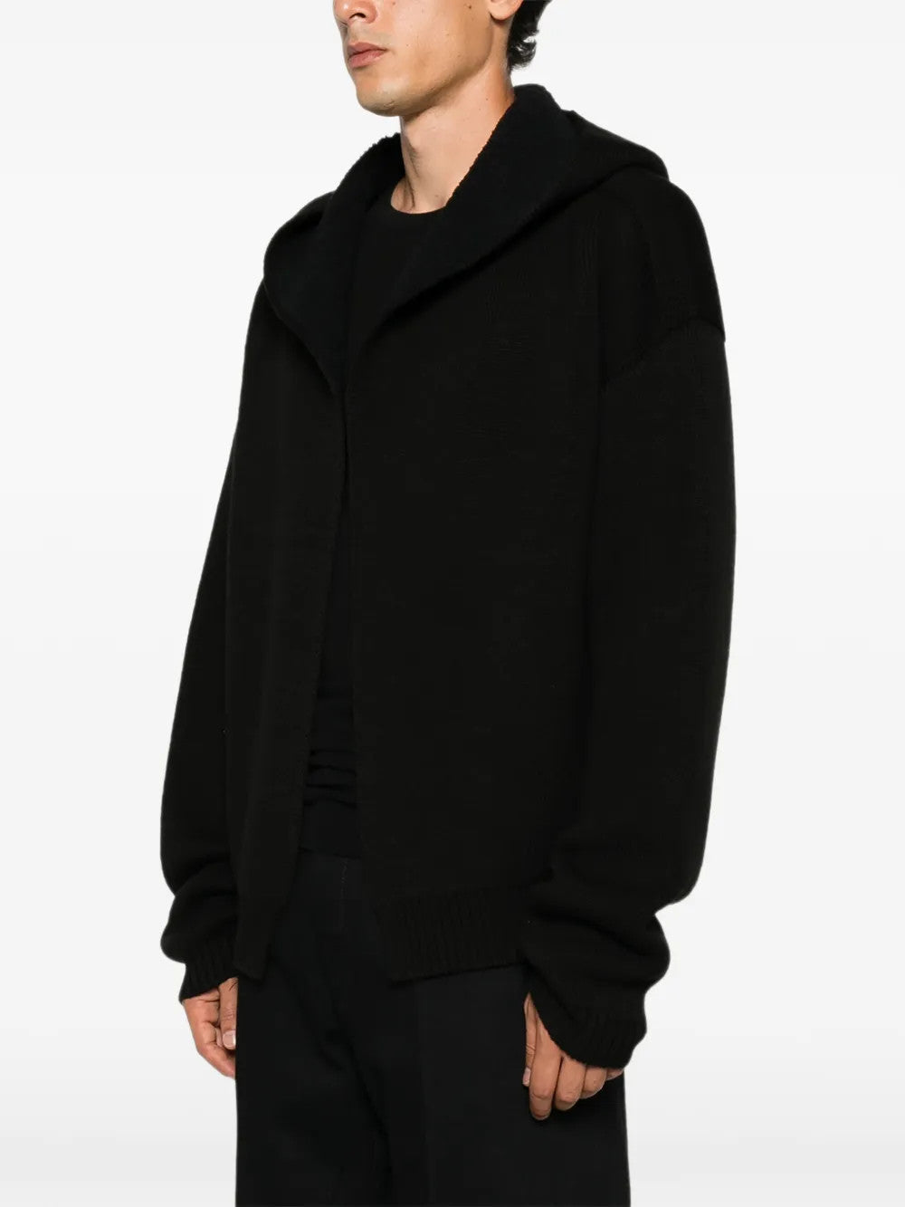 Black hoodie worn by a person, showing the hoodie fit