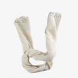 Close up of white scarves, showing texture of the recycled wool and wool fabric