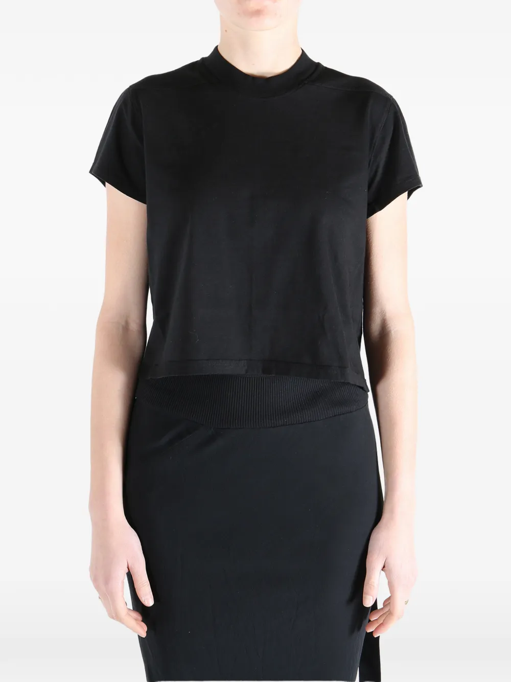 Black t-shirt worn by a person, showing the t-shirt fit