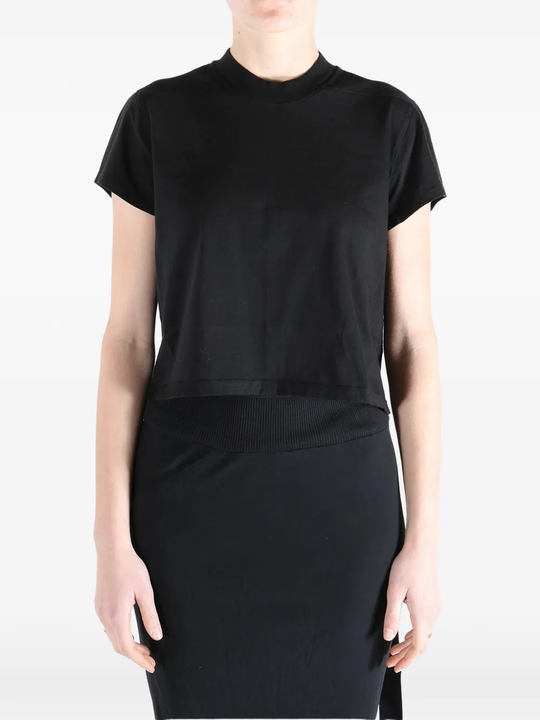 Black t-shirt worn by a person, showing the t-shirt fit