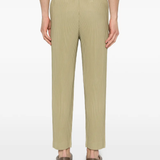 green pants worn by a person, showing the pants fit