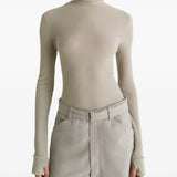 Tan top worn by a person, showing the top's fit