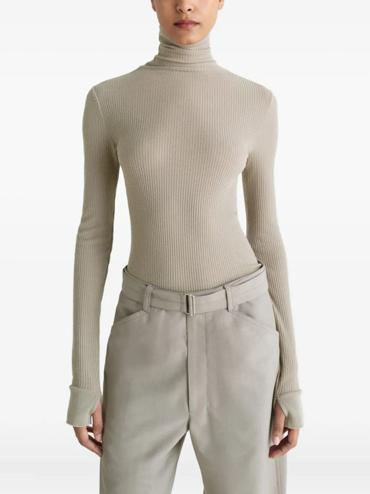 Tan top worn by a person, showing the top's fit