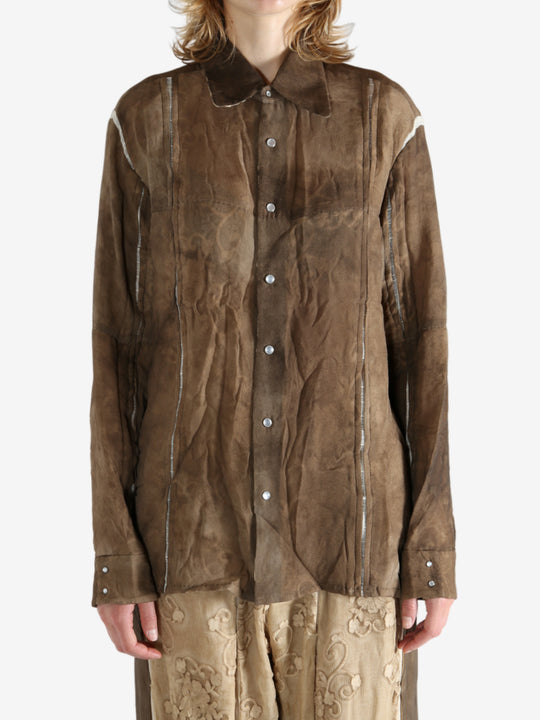 Brown shirt worn by a person, showing the shirt's fit