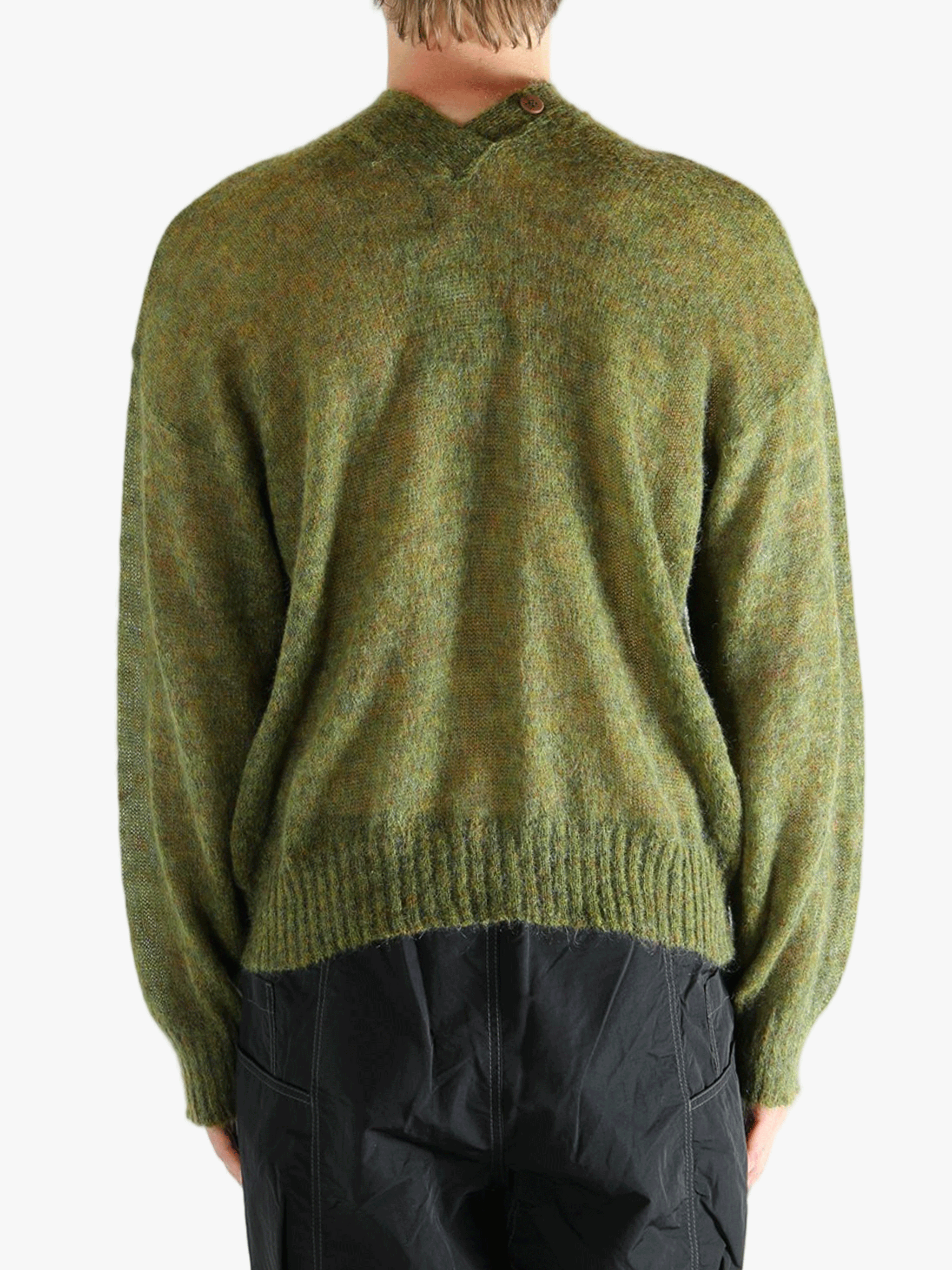 Green cardigan worn by a person, showing the cardigan's fit