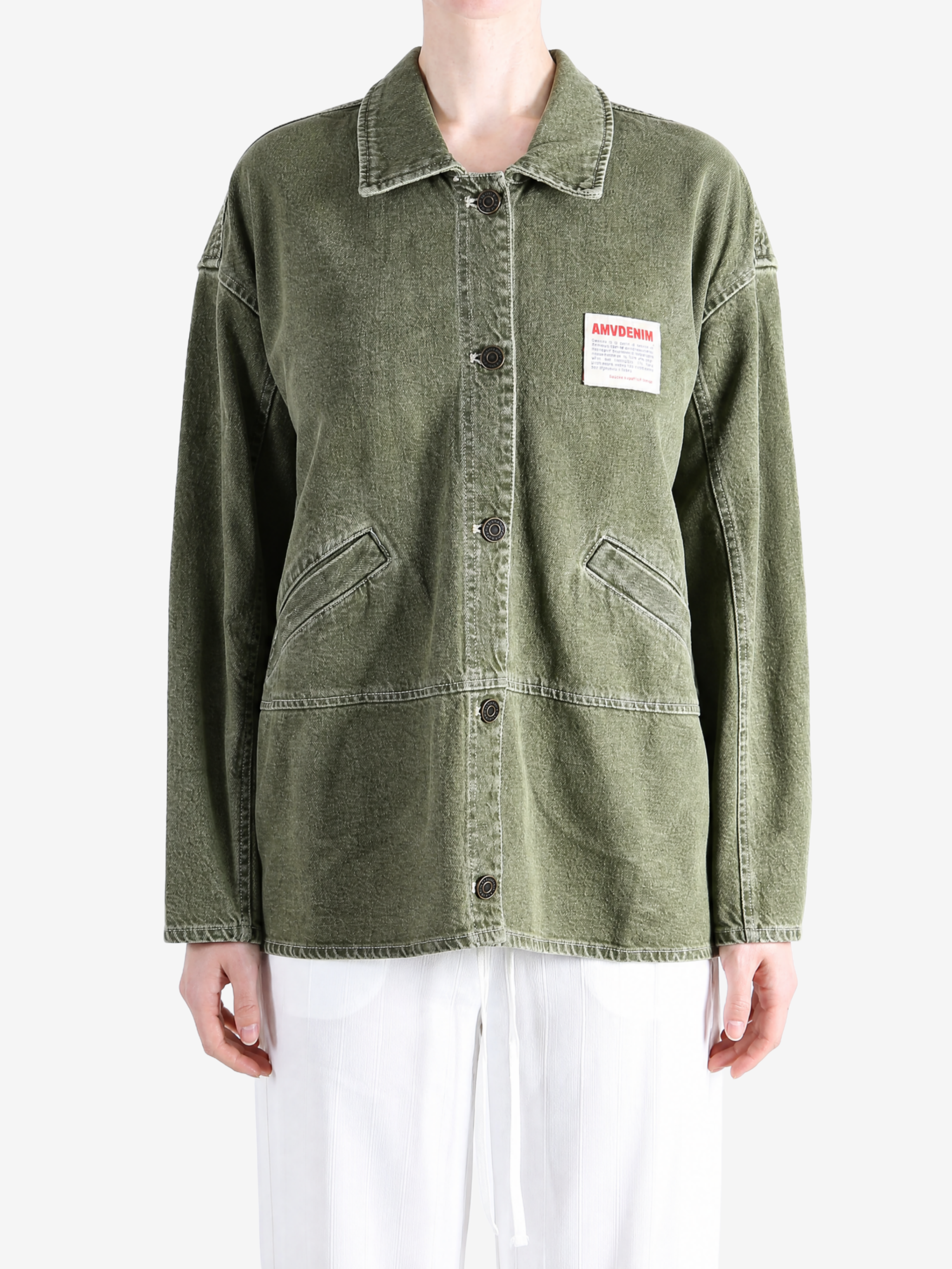 Green jacket worn by a person, showing the jacket fit
