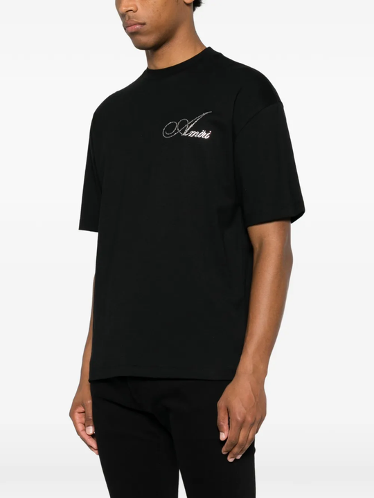  black t-shirt warn a person,showing the t-shirts fit
