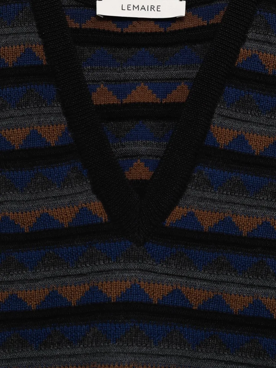 Close up of black vest, showing texture of the Acrylic and Wool fabric