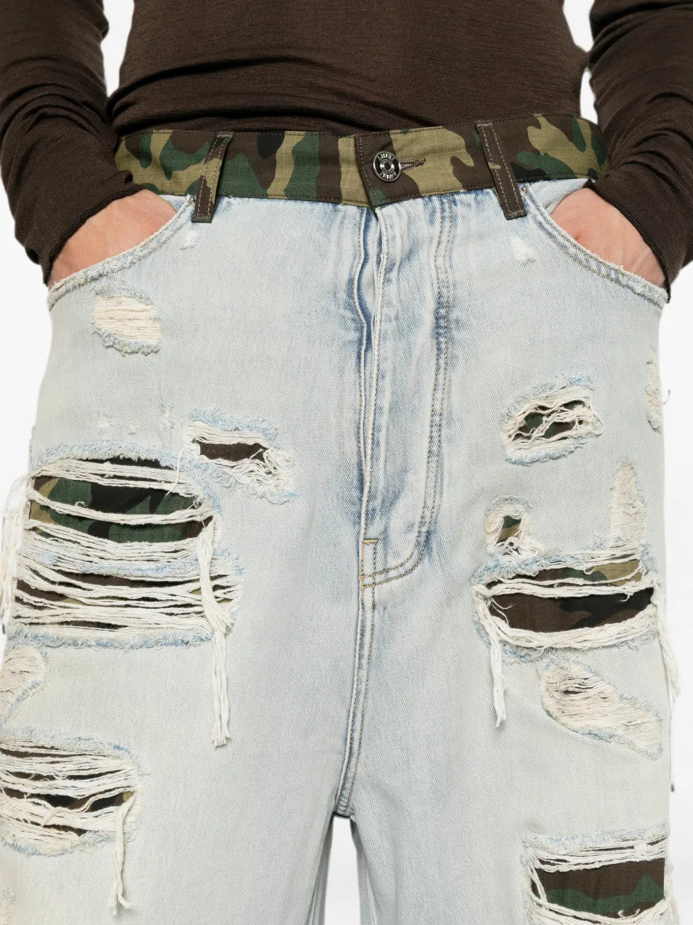 Blue jeans worn by a person, showing the jeans fit