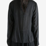 Black top worn by a person, showing the top's fit