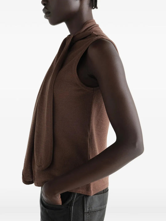 Brown top worn by a person, showing the top fit