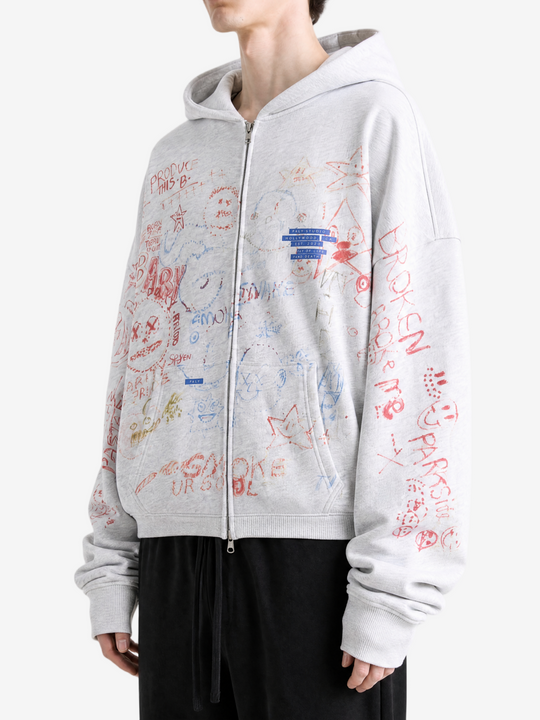 Grey hoodie worn by a person, showing the hoodie fit