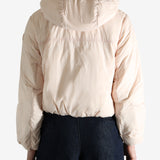 Pink jacket worn by a person, showing the jacket's fit