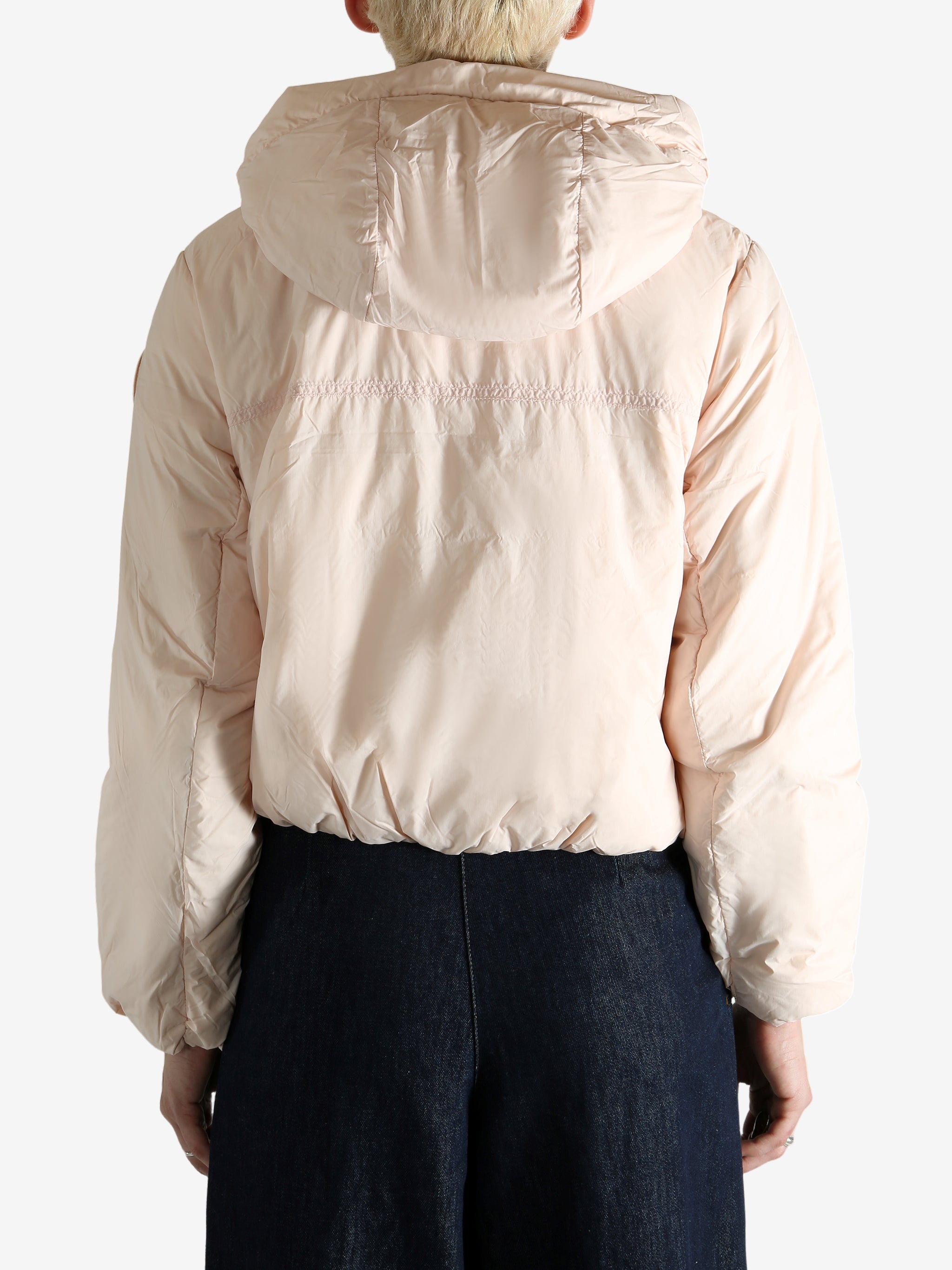 Pink jacket worn by a person, showing the jacket's fit