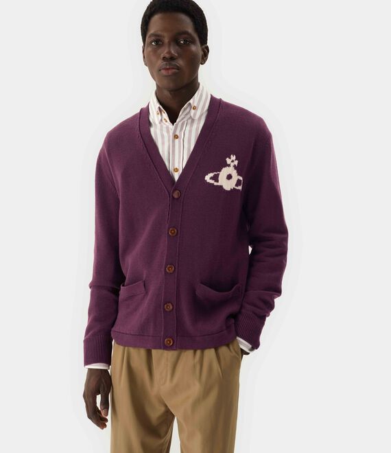 Purple knitwear worn by a person, showing the knitwear fit