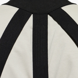 Black top worn by a person, showing the top fit
