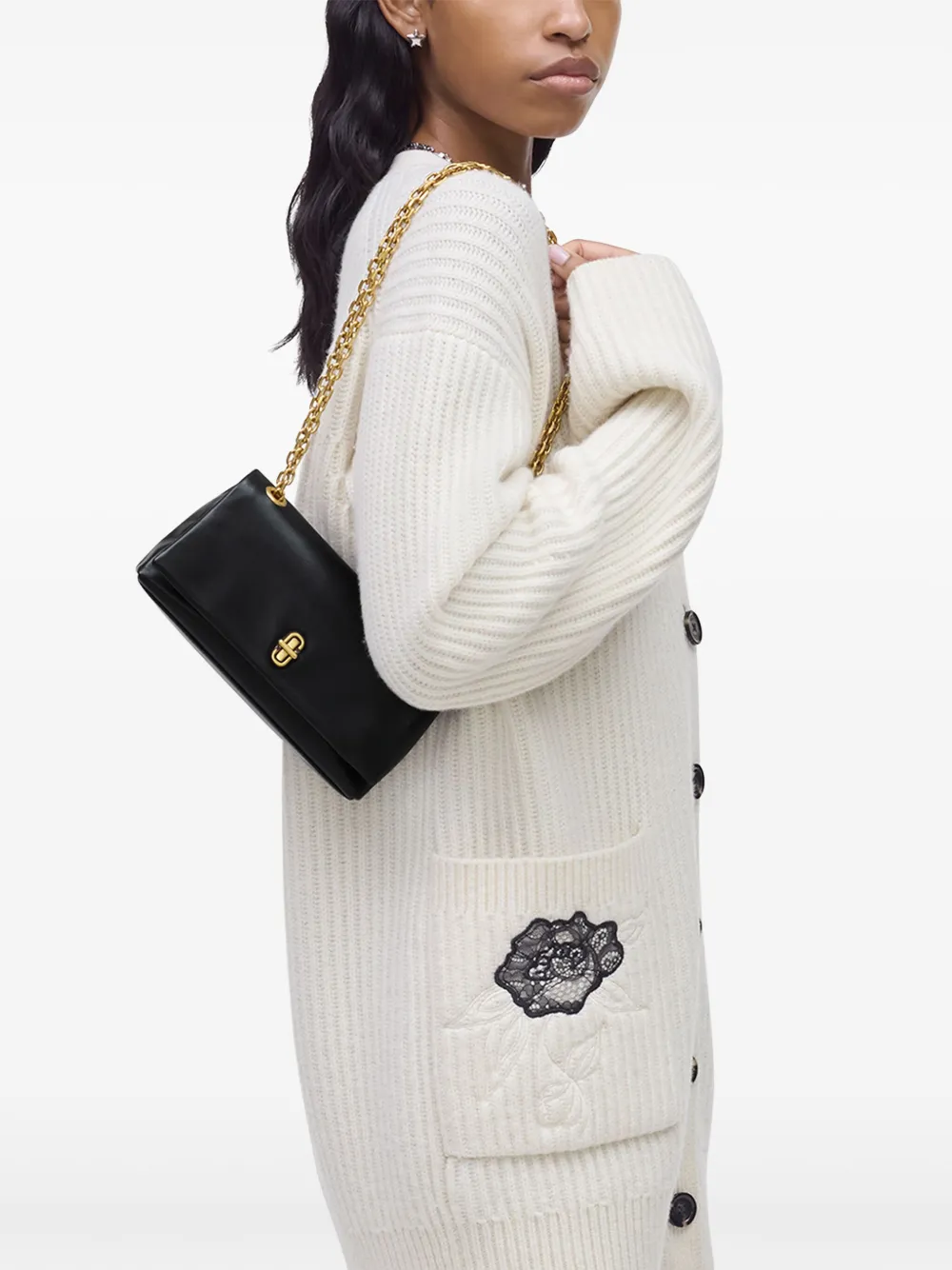 black bags worn by a person, showing the bags fit