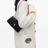 black bags worn by a person, showing the bags fit