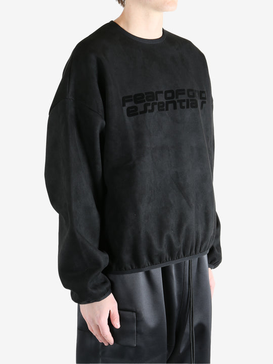 Black sweatshirt worn by a person, showing the sweatshirt's fit