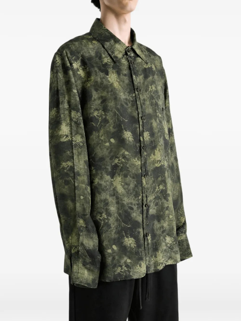 Green top worn by a person, showing the top fit