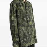 Green top worn by a person, showing the top fit