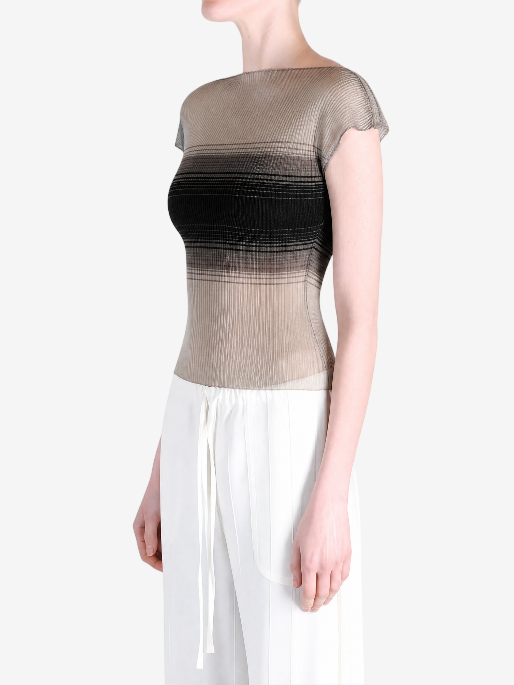 Tan top worn by a person, showing the top fit
