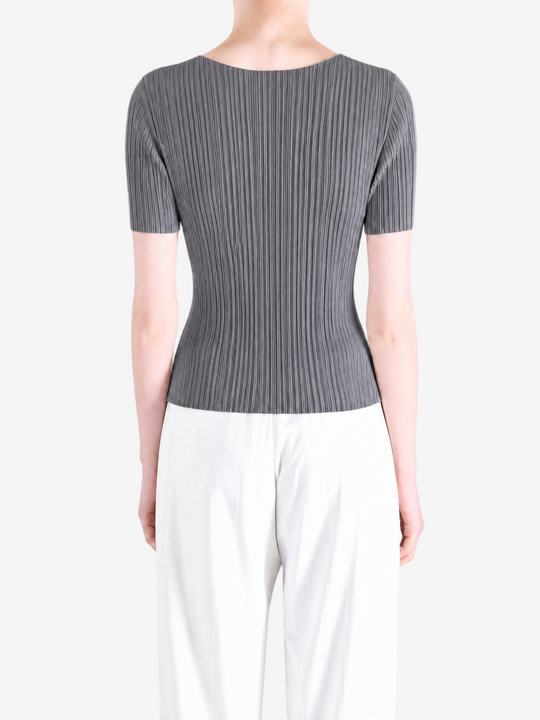 Grey shirt worn by a person, showing the shirt fit