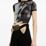 Black t-shirt worn by a person, showing the t-shirt fit
