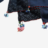 Close up of the navy scarf, showing texture of the wool fabric