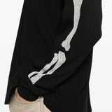 Close up of the black t-shirt, showing texture of the cotton fabric