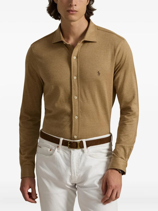 Brown shirt worn by a person, showing the shirt's fit