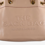 Close up of pink bag, showing texture of the leather fabric