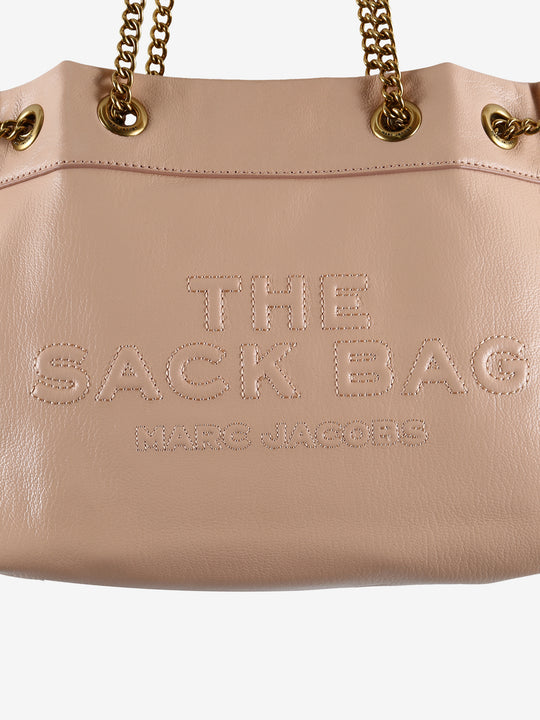 Close up of pink bag, showing texture of the leather fabric