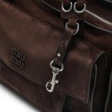 Close up of Brown bags, showing texture of the calf suede fabric