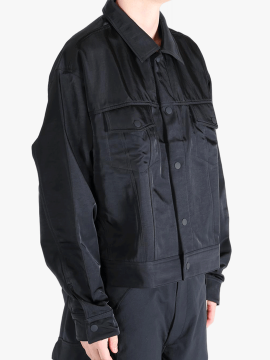 Black jacket worn by a person, showing the jackets fit